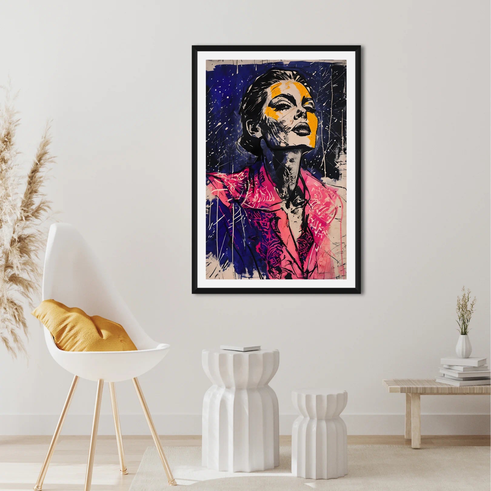 Framed abstract art of a woman's face in a modern living room setting.