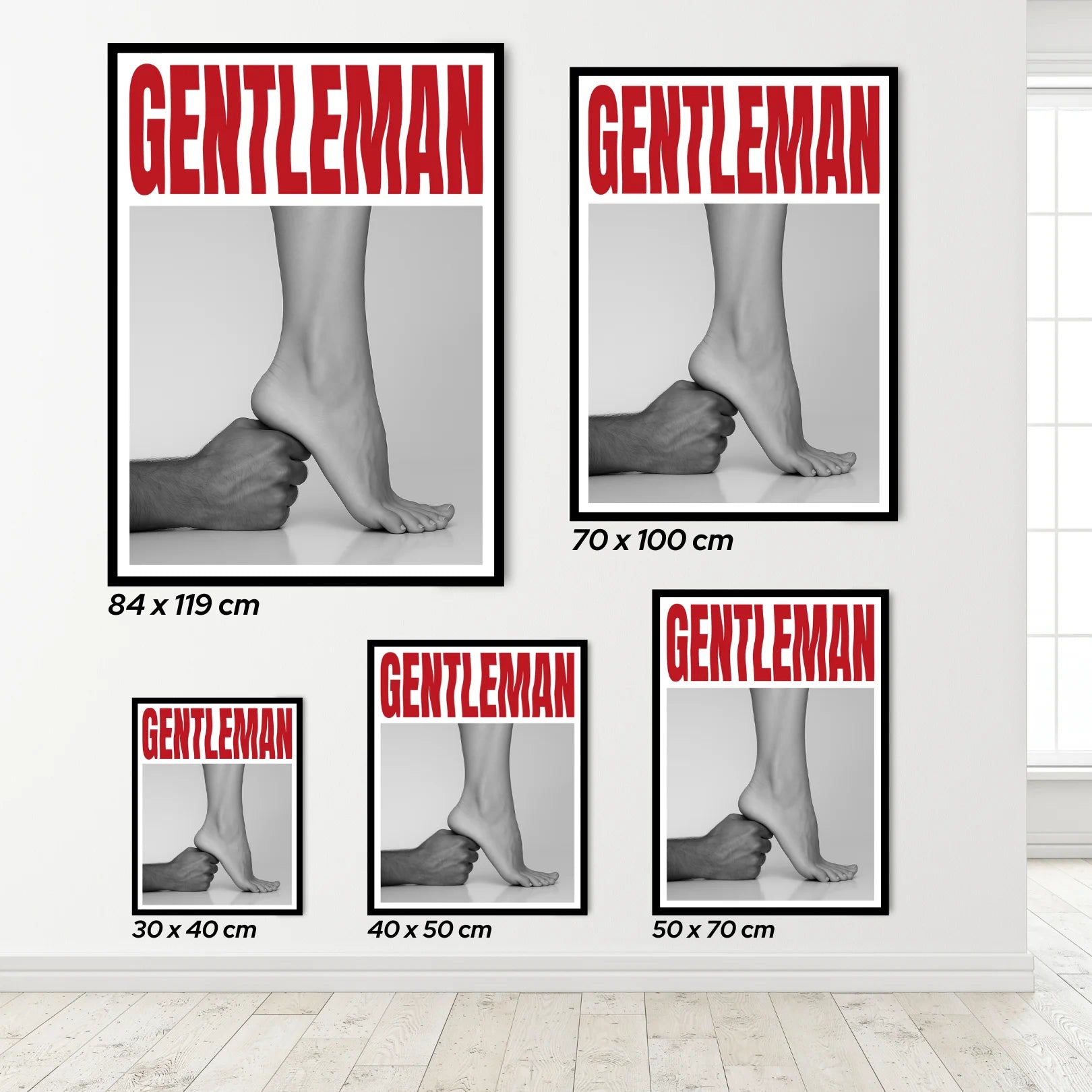 Set of 'GENTLEMAN' posters with different sizes displayed on a wall.