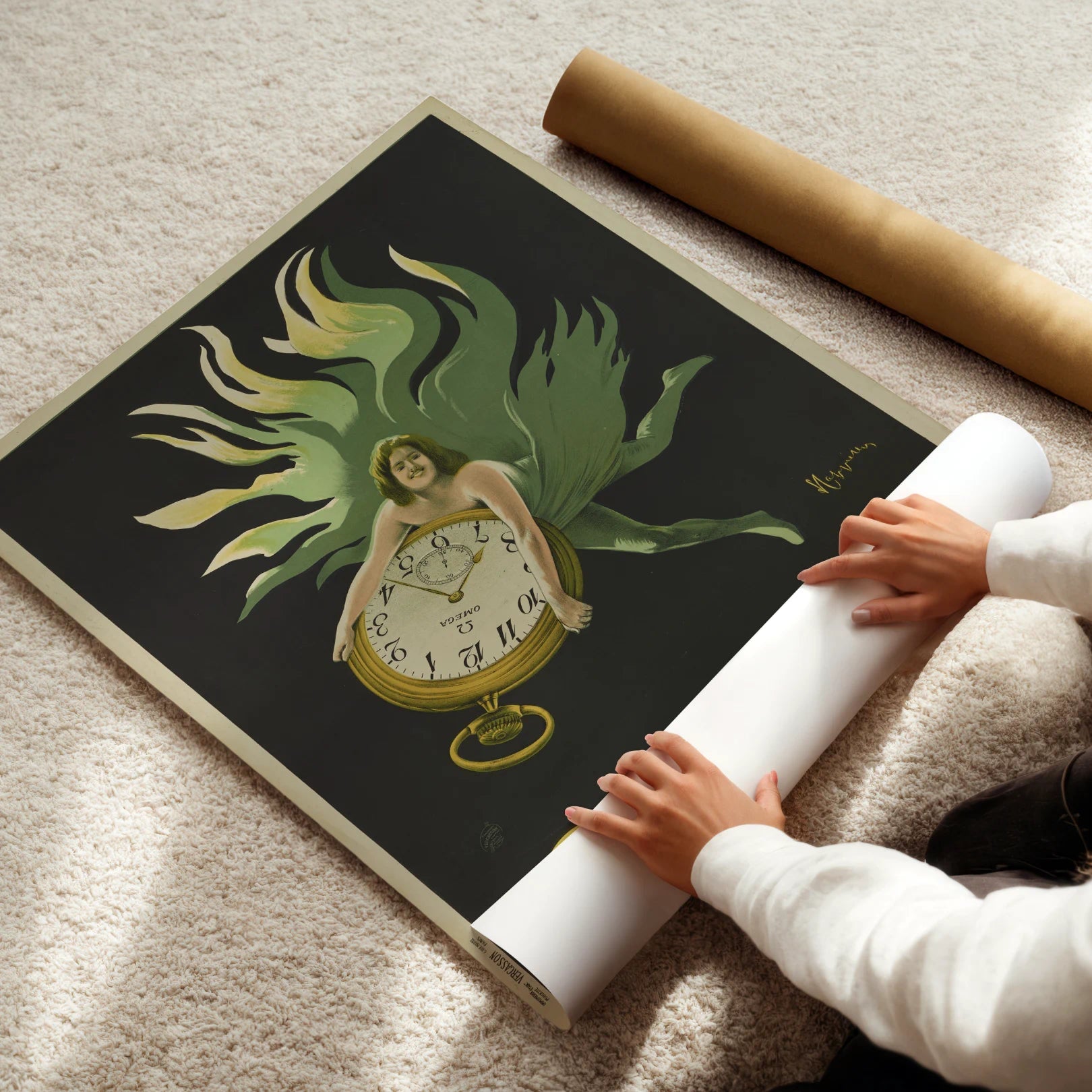 Person unrolling a large artwork featuring a clock and a figure on a dark background.