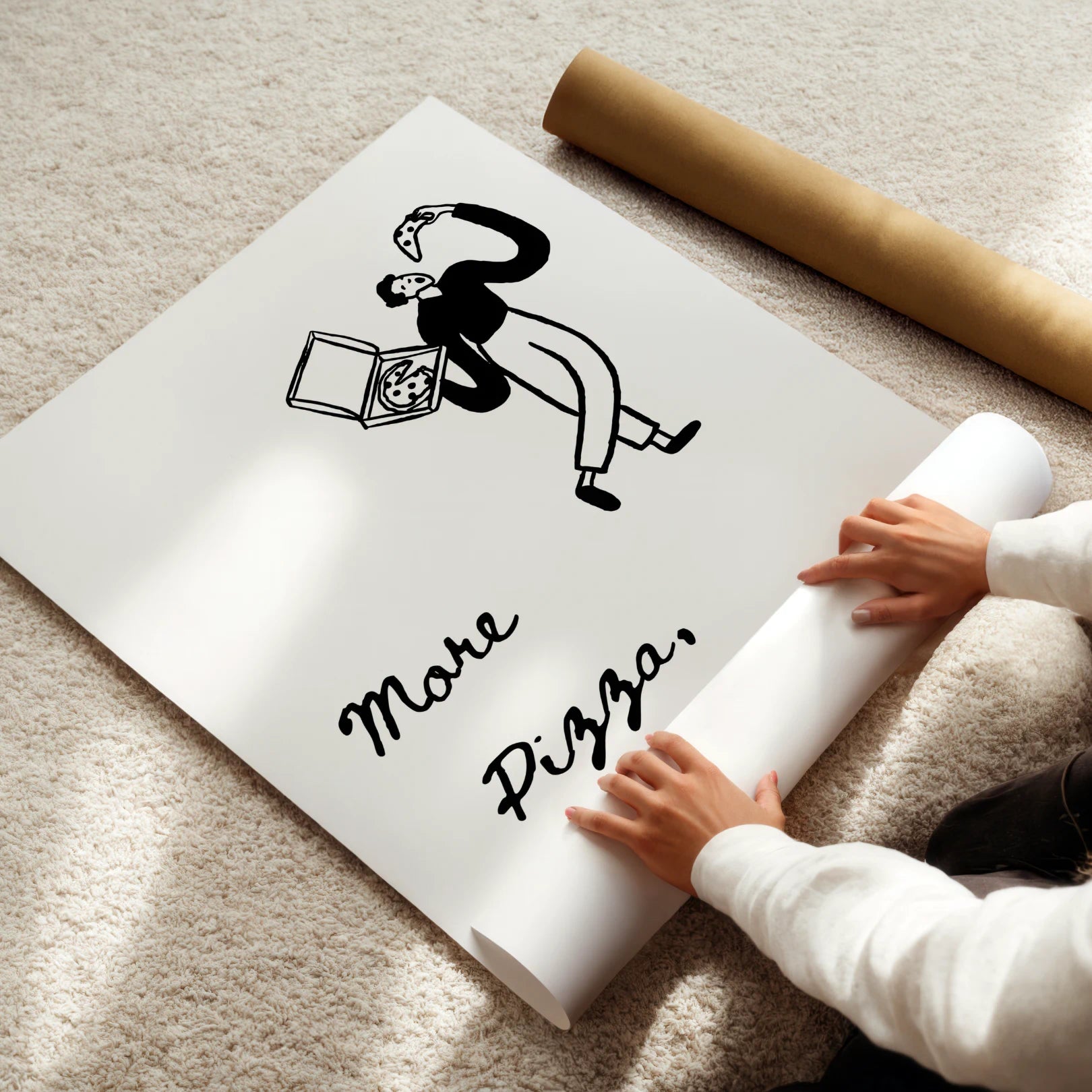 Person unrolling a large poster with a graphic and text on a carpeted floor.
