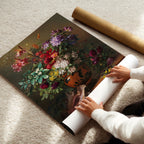 Person unrolling a large floral poster on a carpeted floor