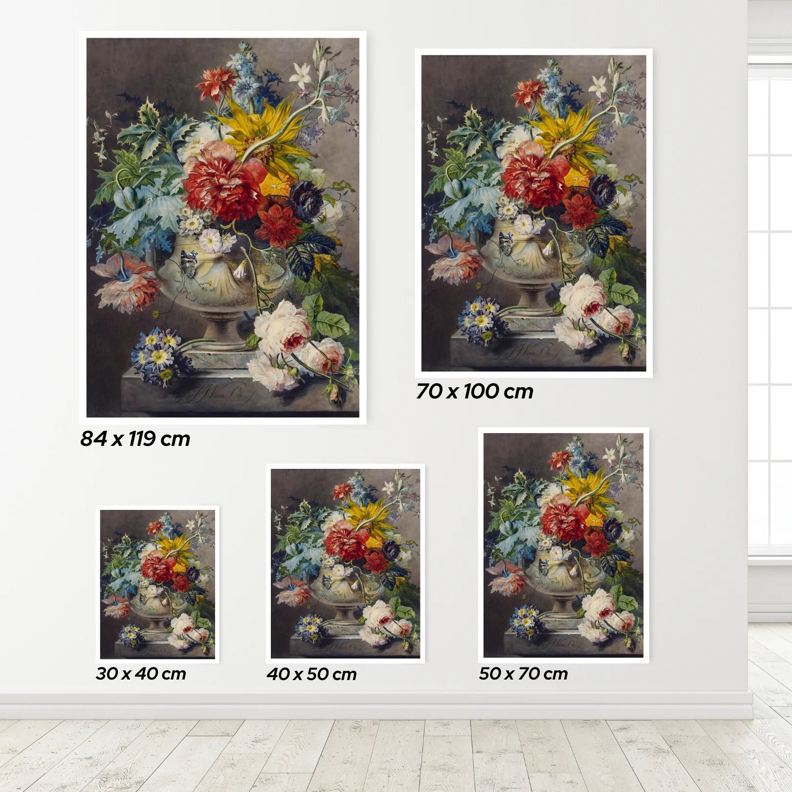 Set of floral posters in various sizes on a white wall.