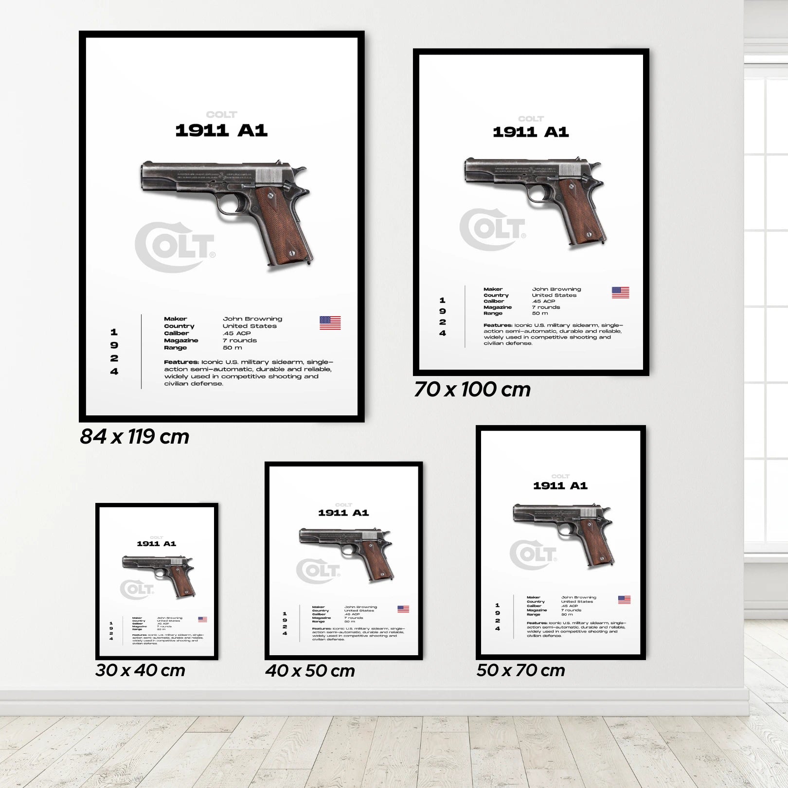 Set of framed posters of a Colt 1911 A1 pistol on a white wall.