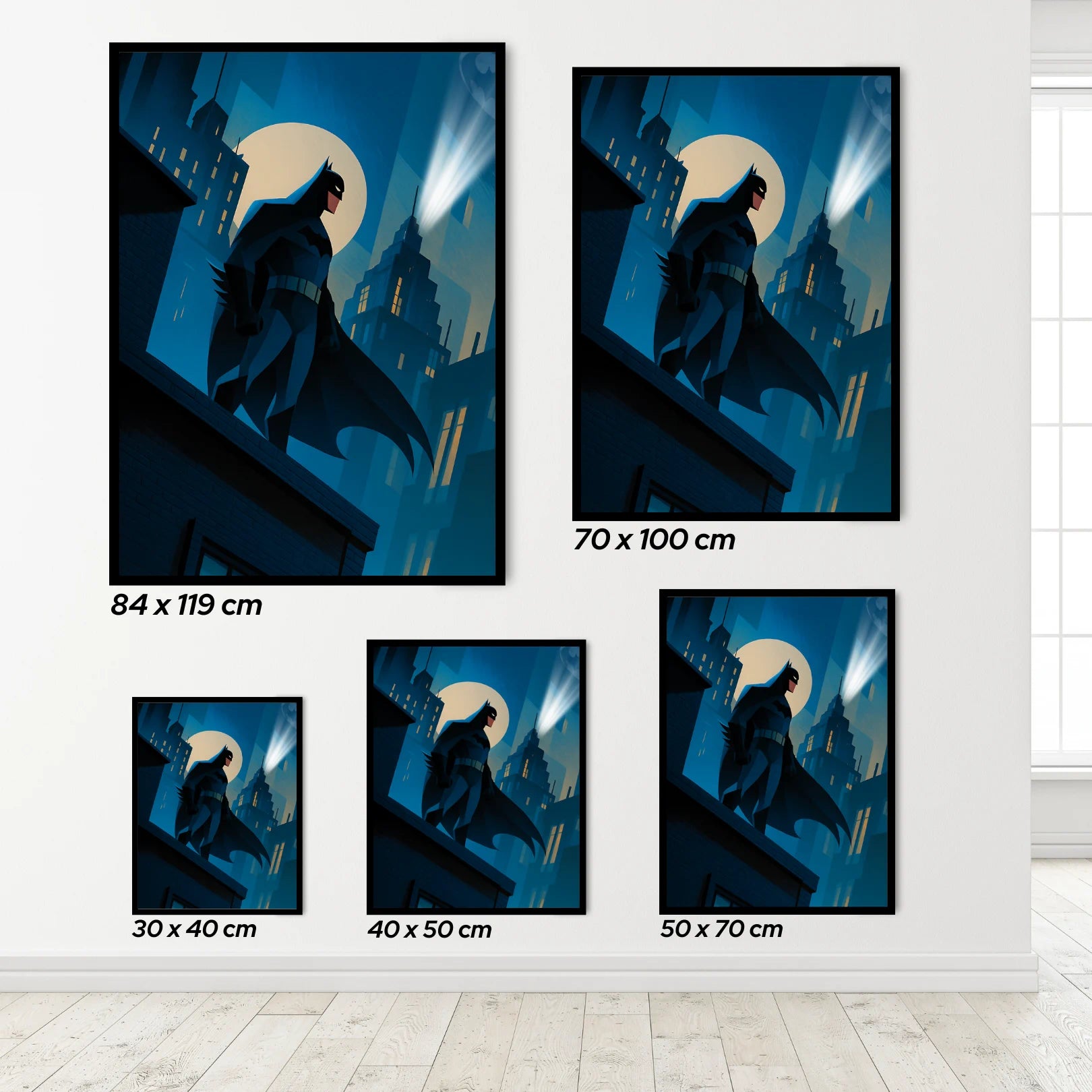 Set of Batman wall art prints in various sizes on a white wall.