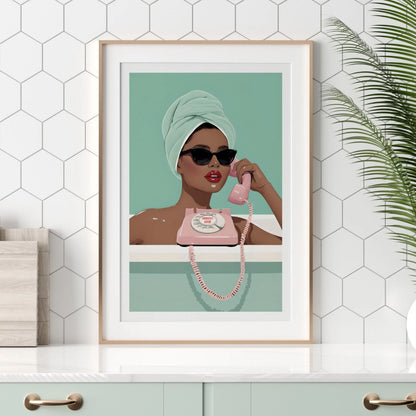 Emergency Gossip wall print with chic woman in bath, displayed in modern white-tiled kitchen with greenery