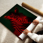 Person unrolling a red and black zebra poster on a beige carpet