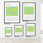 Set of gemini zodiac framed posters with abstract designs and text on a white wall.