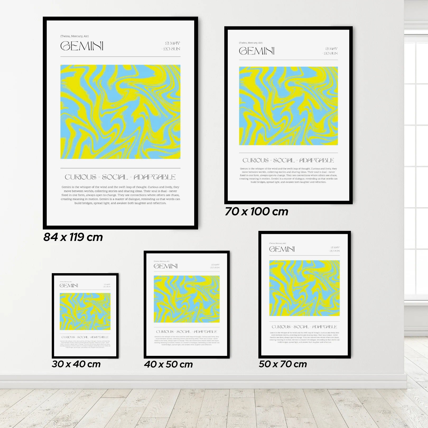 Set of gemini zodiac framed posters with abstract designs and text on a white wall.