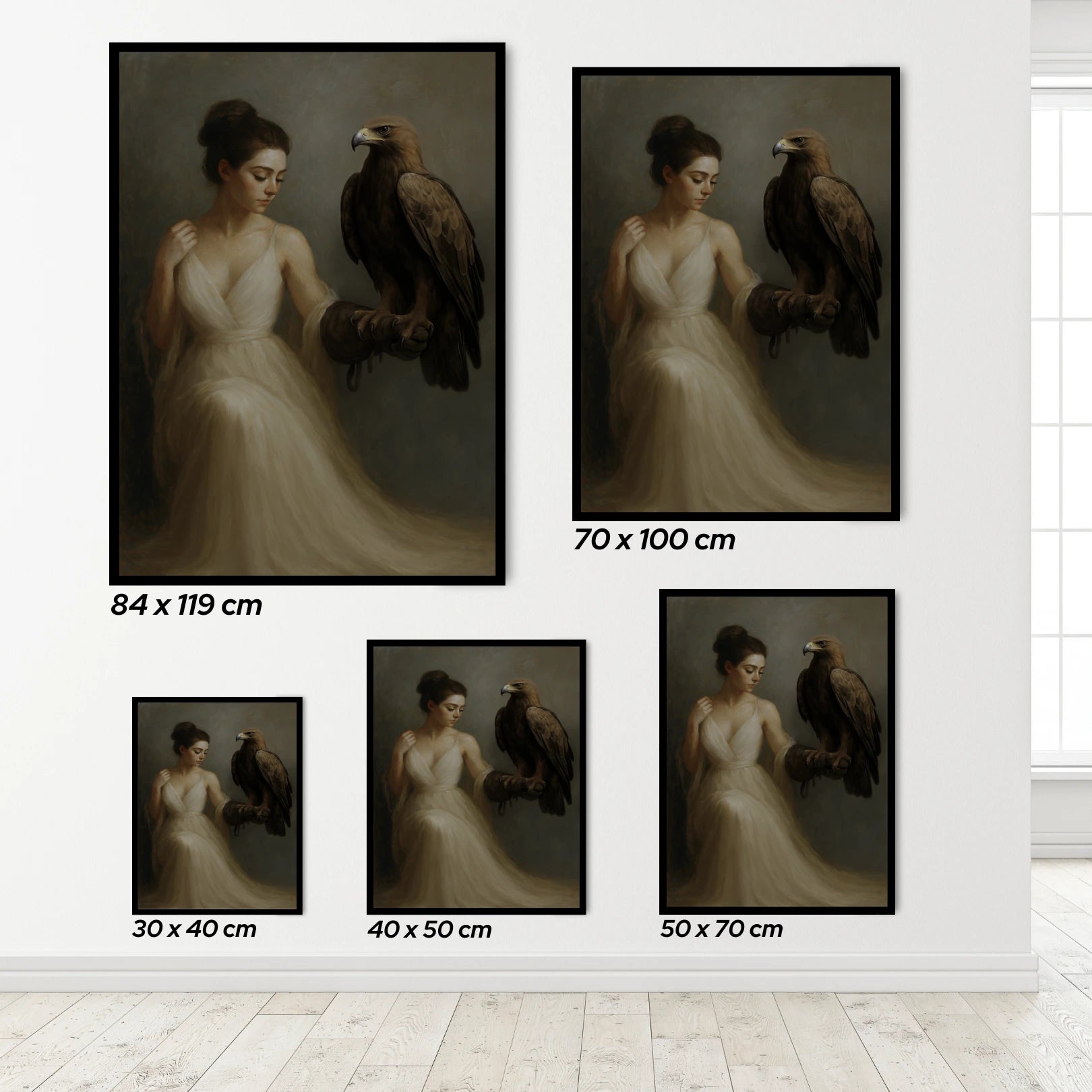Set of framed artworks of a woman holding an eagle with varying sizes displayed on a wall.