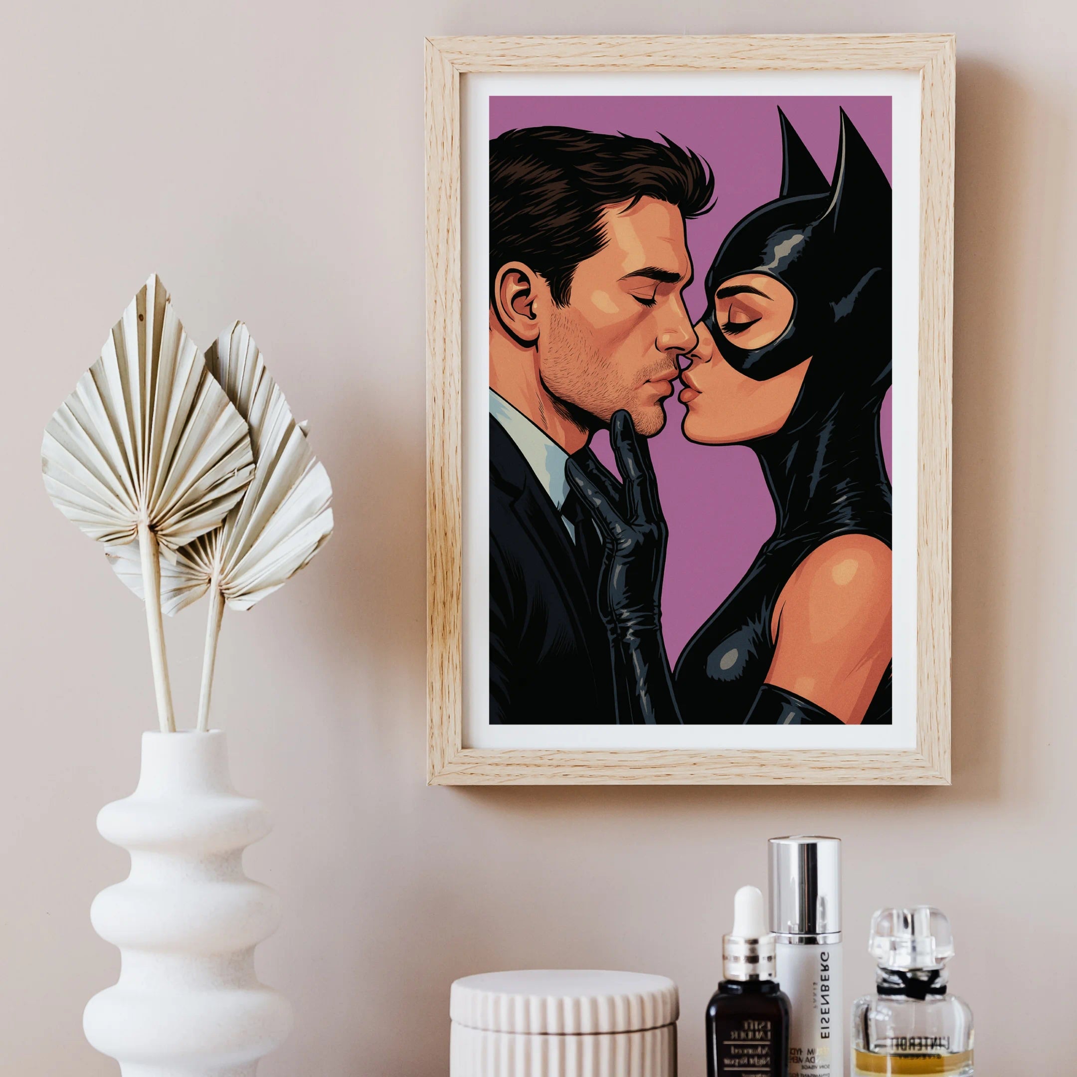 Stylish artwork “Kiss of Control” hanging in a chic neutral-toned space with dried floral décor and beauty products.