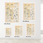 Set of floral prints with dimensions displayed on a wall.
