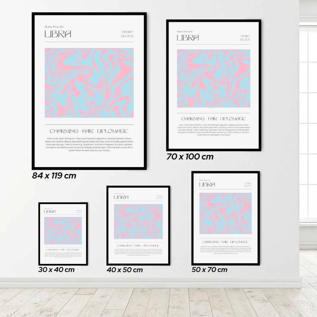 Set of framed posters with Libra zodiac design on a white wall.