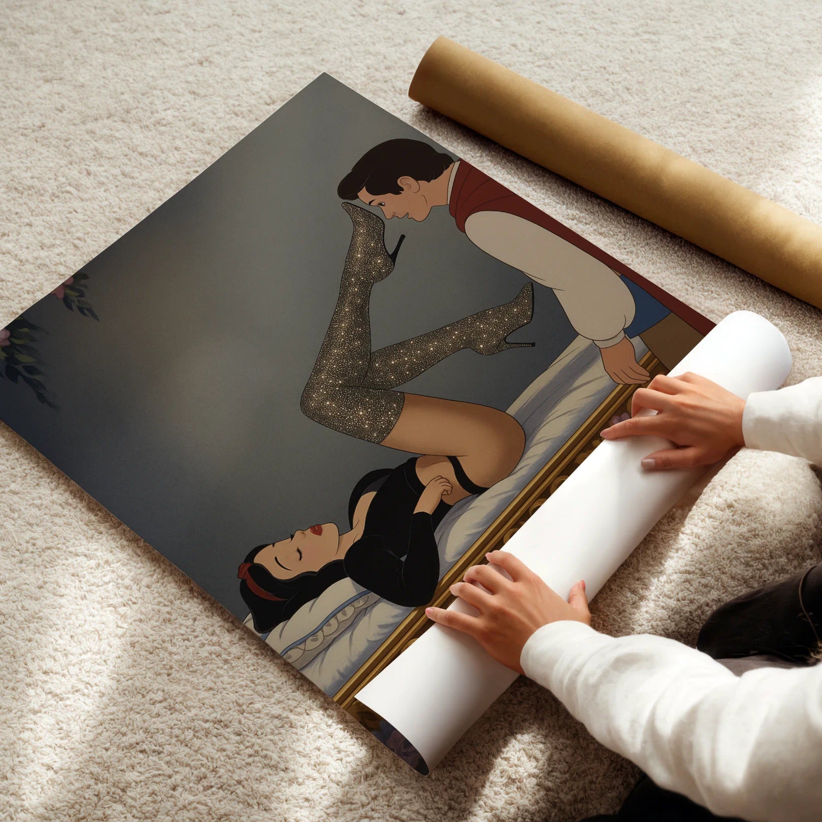 Person unrolling a large poster of Snow White on a carpeted floor.