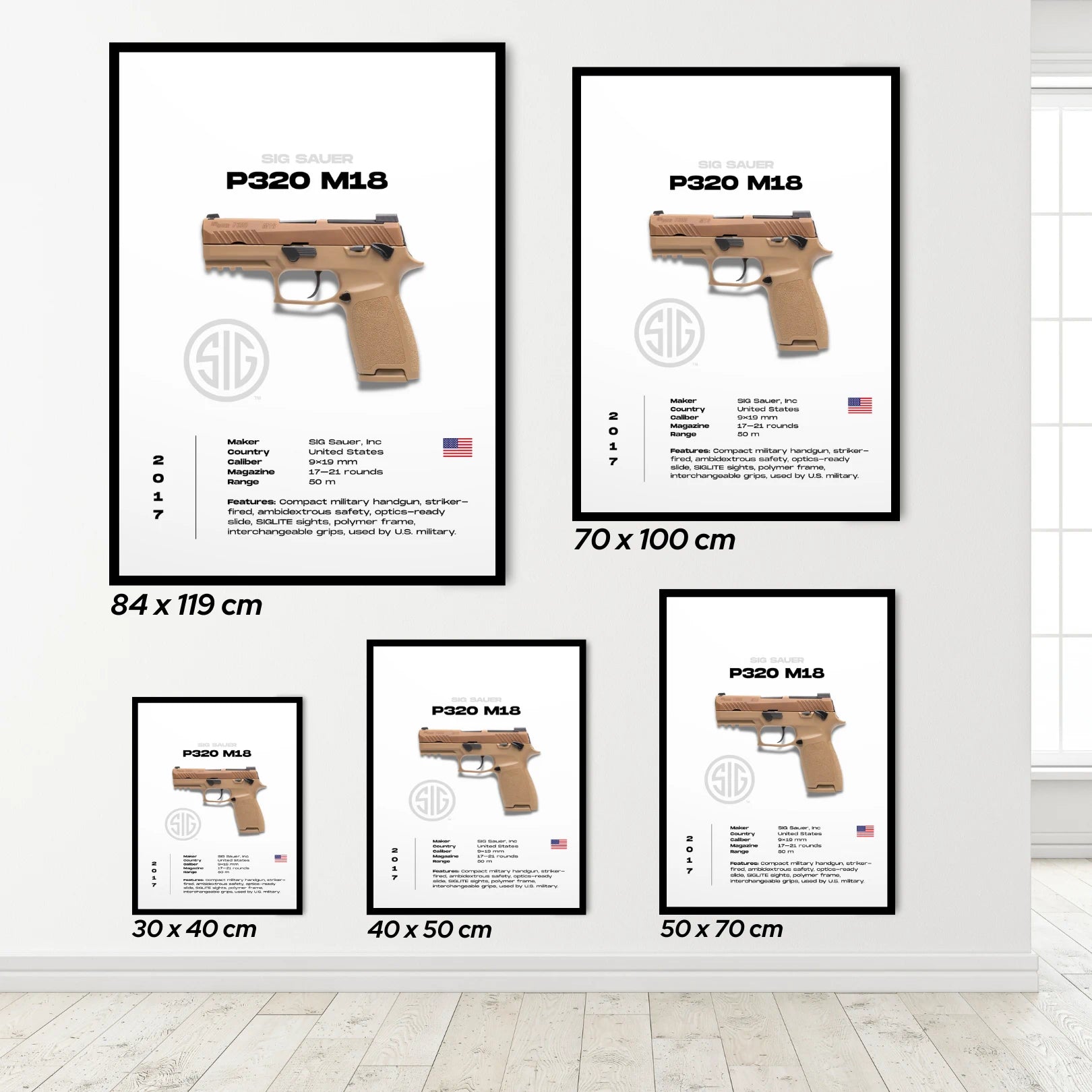 Framed posters of sig sauer gun with dimensions displayed on a white wall.
