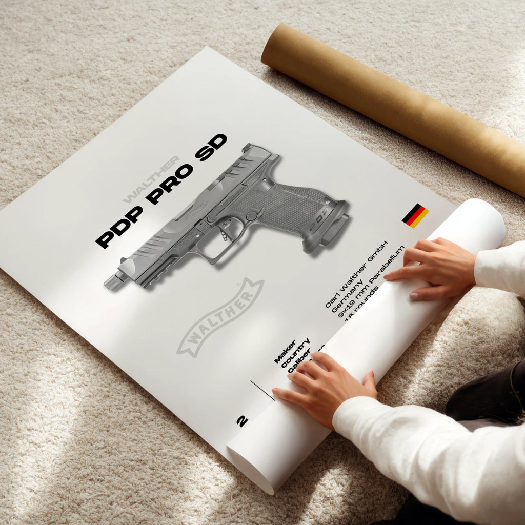Person unrolling a poster of a gun model with 'Walther' branding on a light-colored floor.