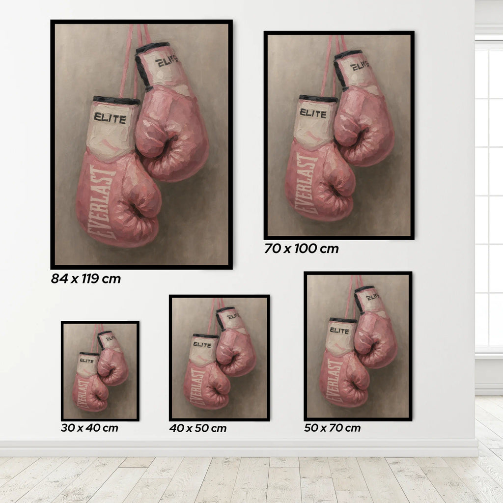Framed prints of pink boxing gloves with 'Everlast' branding on a white wall.