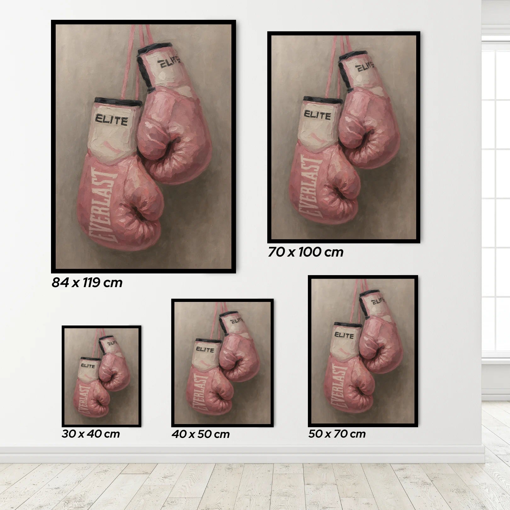Framed prints of pink boxing gloves with 'Everlast' branding on a white wall.