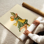 Person unrolling a poster of a woman holding a large cannabis joint on a light-colored floor.
