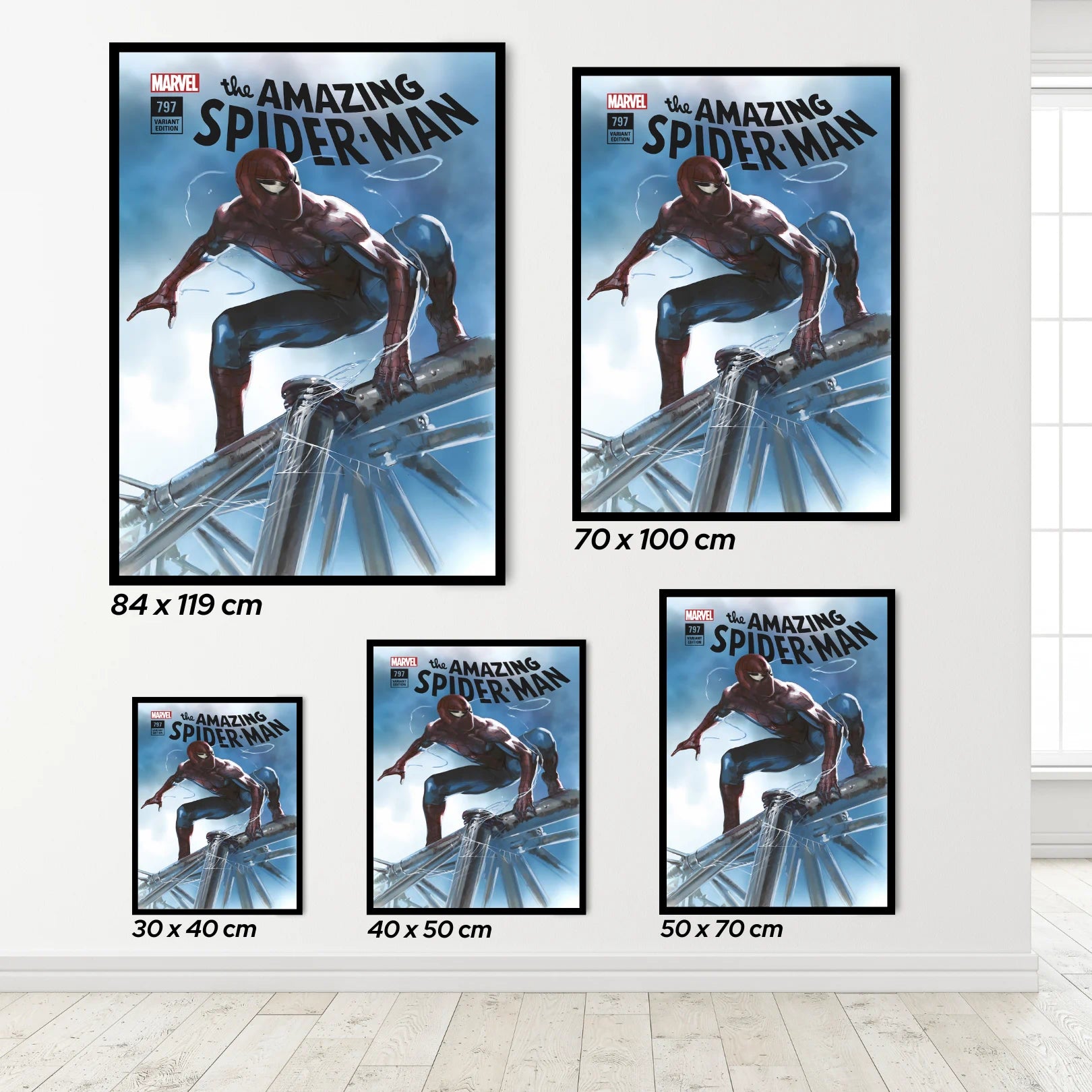 Set of 'The Amazing Spider-Man' posters in various sizes on a white wall.