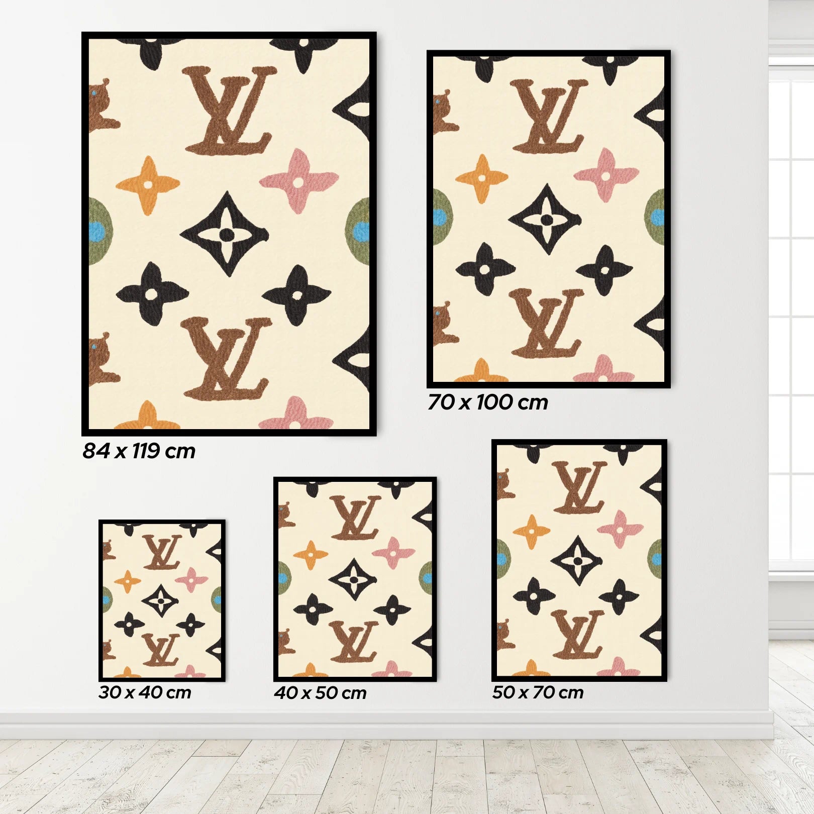 Set of decorative wall art with Louis Vuitton pattern on a white wall.