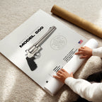 Person unrolling a poster of a smith & Wesson revolver with 'Model 500' text on a carpeted floor.