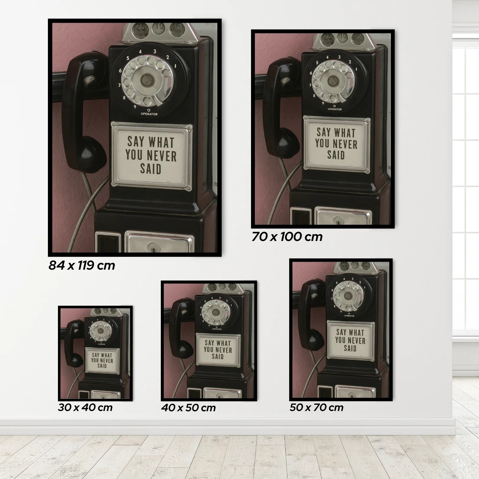 Set of framed prints with vintage phone design and text on a white wall.