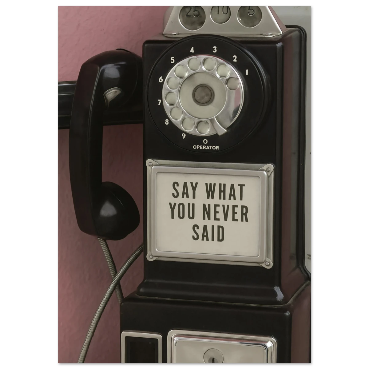 Vintage-style rotary phone with a label on a white background